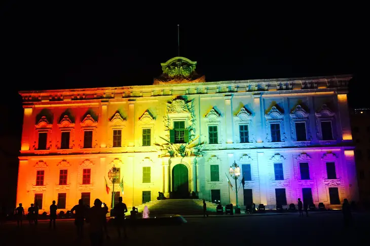 Auberge de Castille illuminated for Pride Week